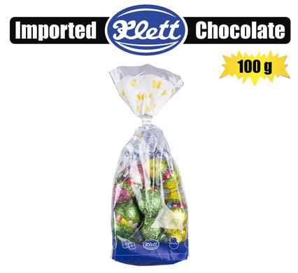 Assorted sweet chocolate Easter eggs in shiny foil bags, perfect for gifting and events.